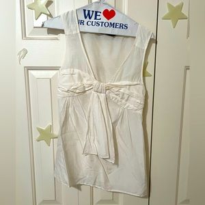 Zara White Sleeveless blouse with ribbon.